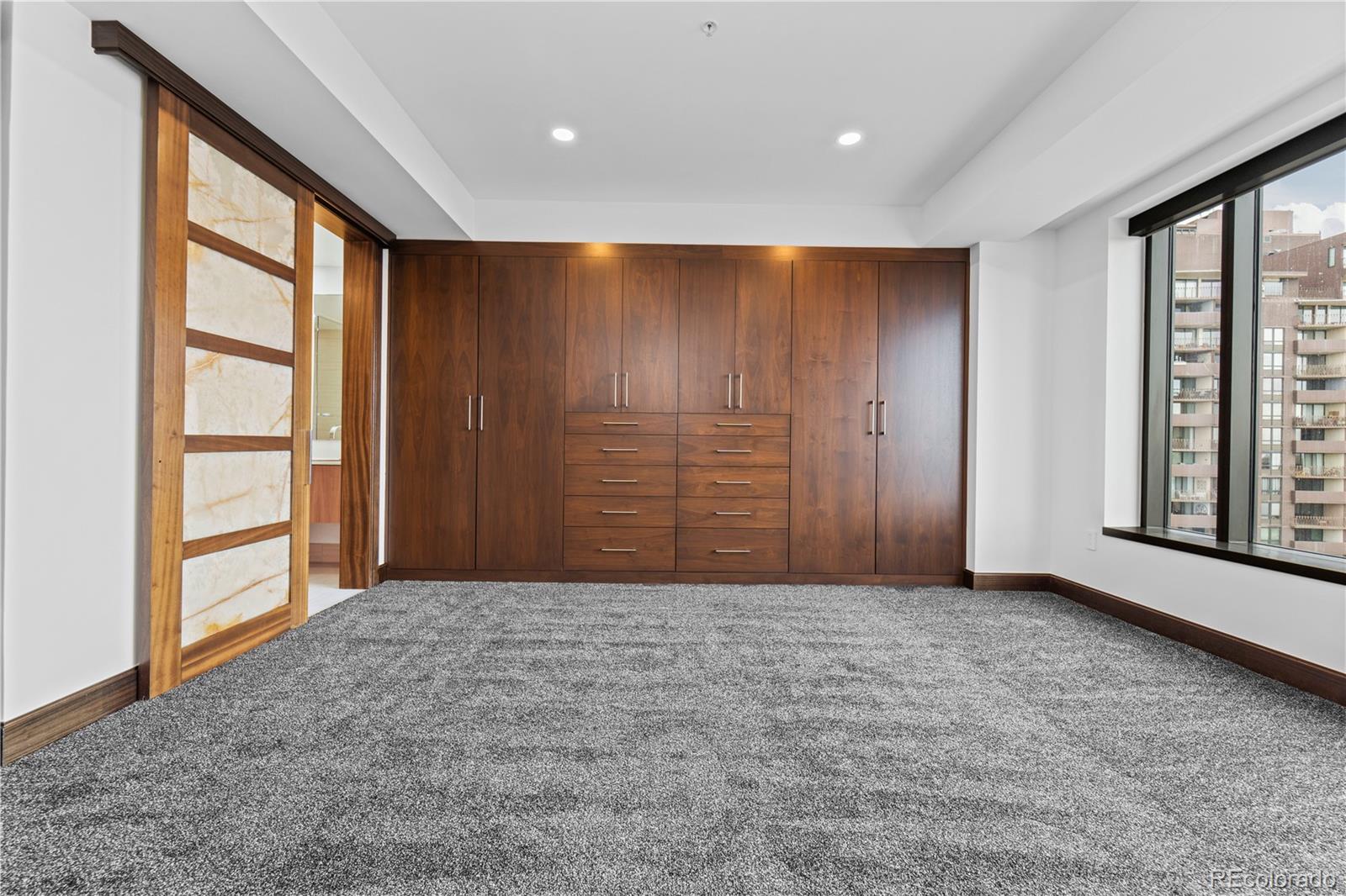1133 14th Street, Unit 2620 Denver, CO 80202 - Photo 22 of 43 an empty room with windows and closet