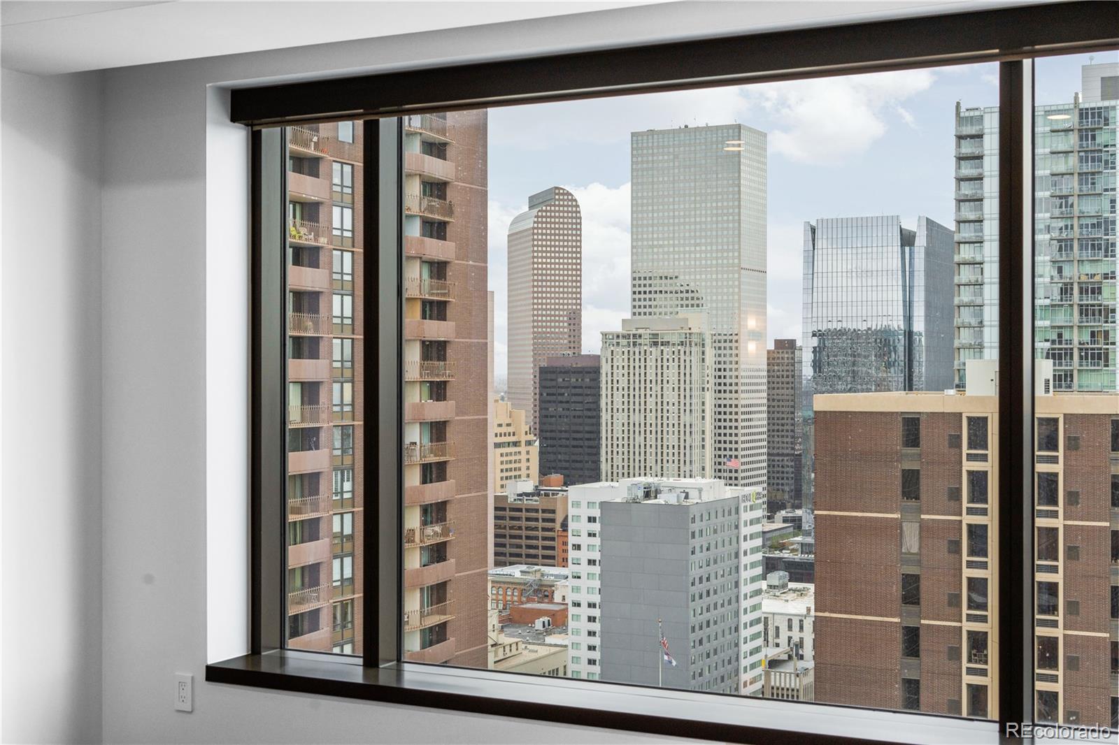 1133 14th Street, Unit 2620 Denver, CO 80202 - Photo 24 of 43 a view of a balcony with a floor to ceiling window