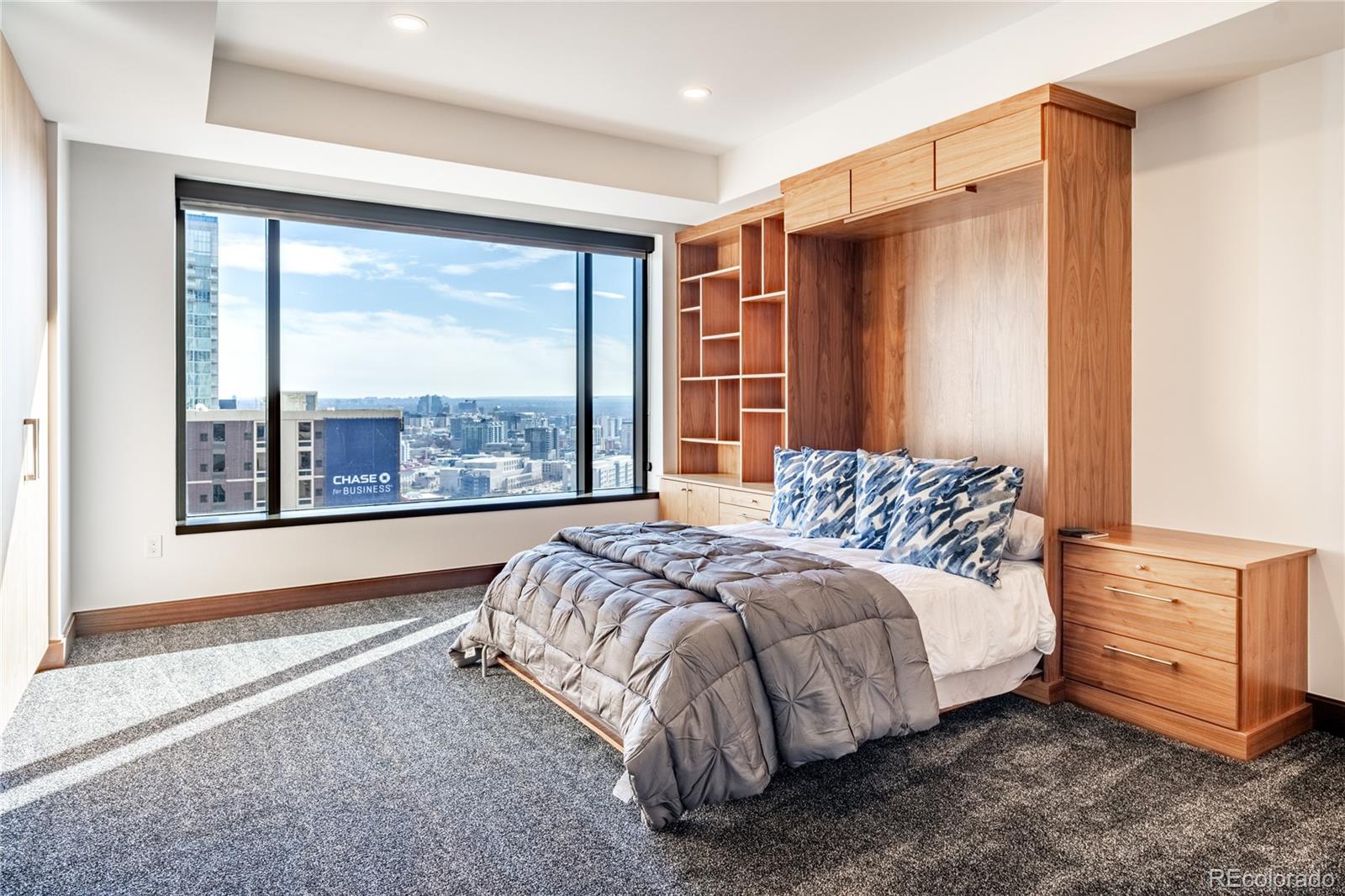 1133 14th Street, Unit 2620 Denver, CO 80202 - Photo 27 of 43 a bedroom with a large bed and a large window