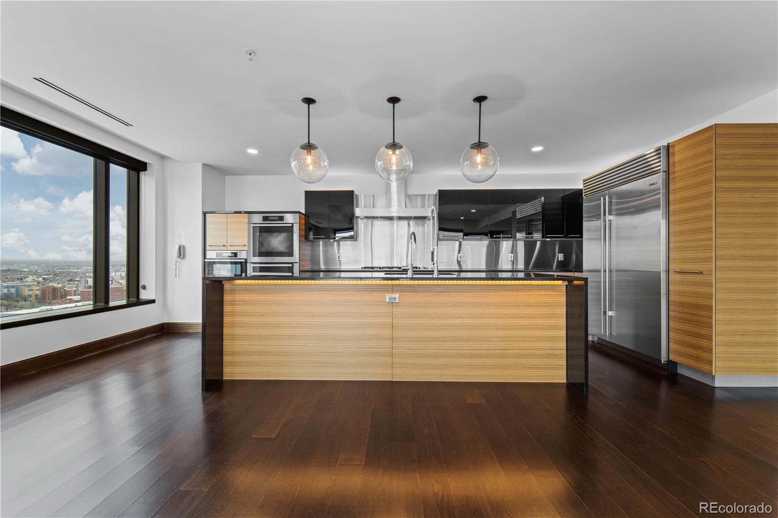 1133 14th Street, Unit 2620 Denver, CO 80202 - Photo 10 of 43 a view of kitchen with stainless steel appliances granite countertop counter top and a view of living room