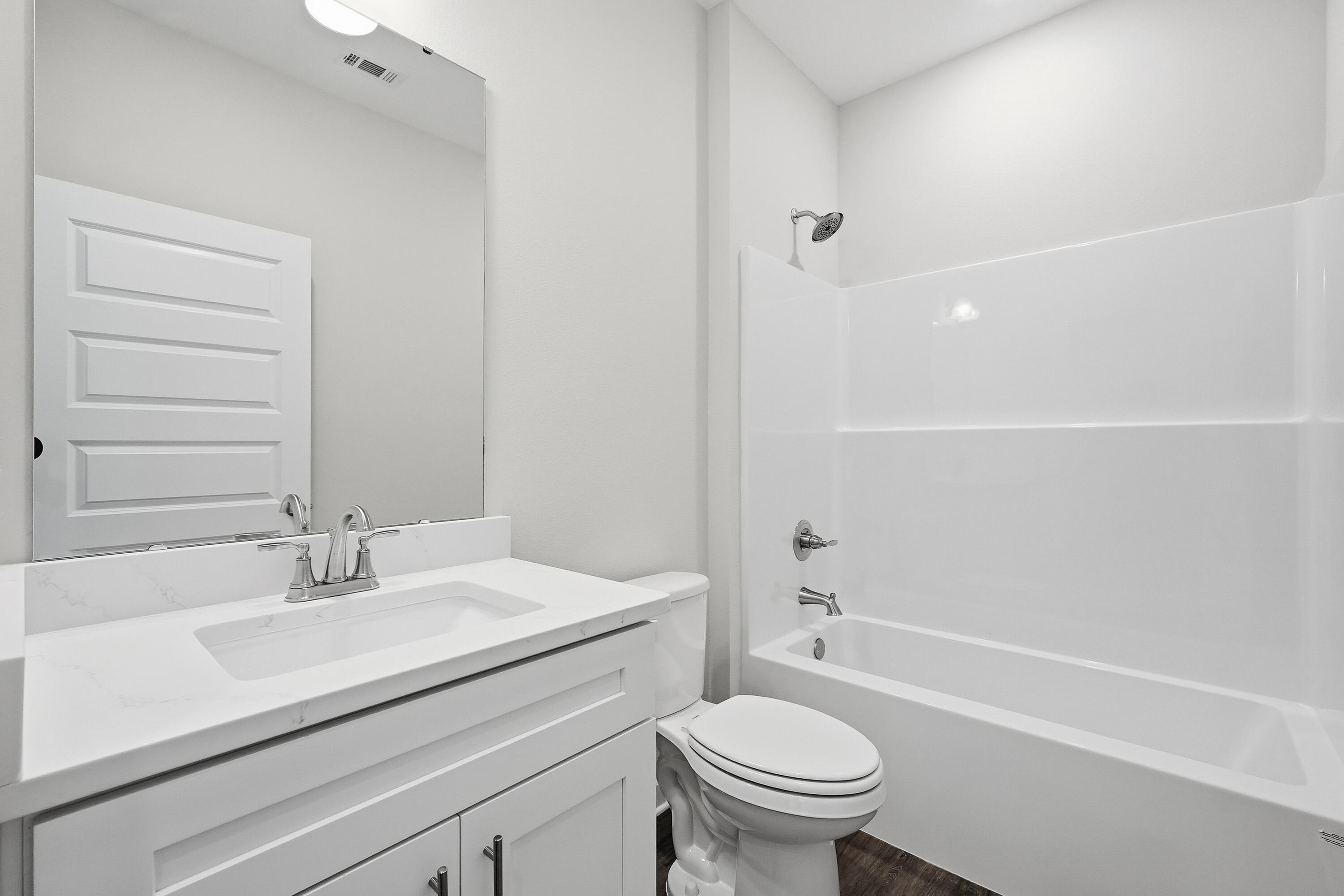 6106 Mildred's Way Crestview, FL 32539 - Photo 23 of 31 a bathroom with a sink toilet and shower