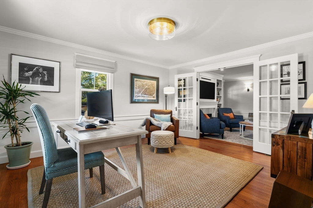 37 Moorland Road Scituate, MA 02066 - Photo 11 of 38 a living room with furniture potted plant and a flat screen tv
