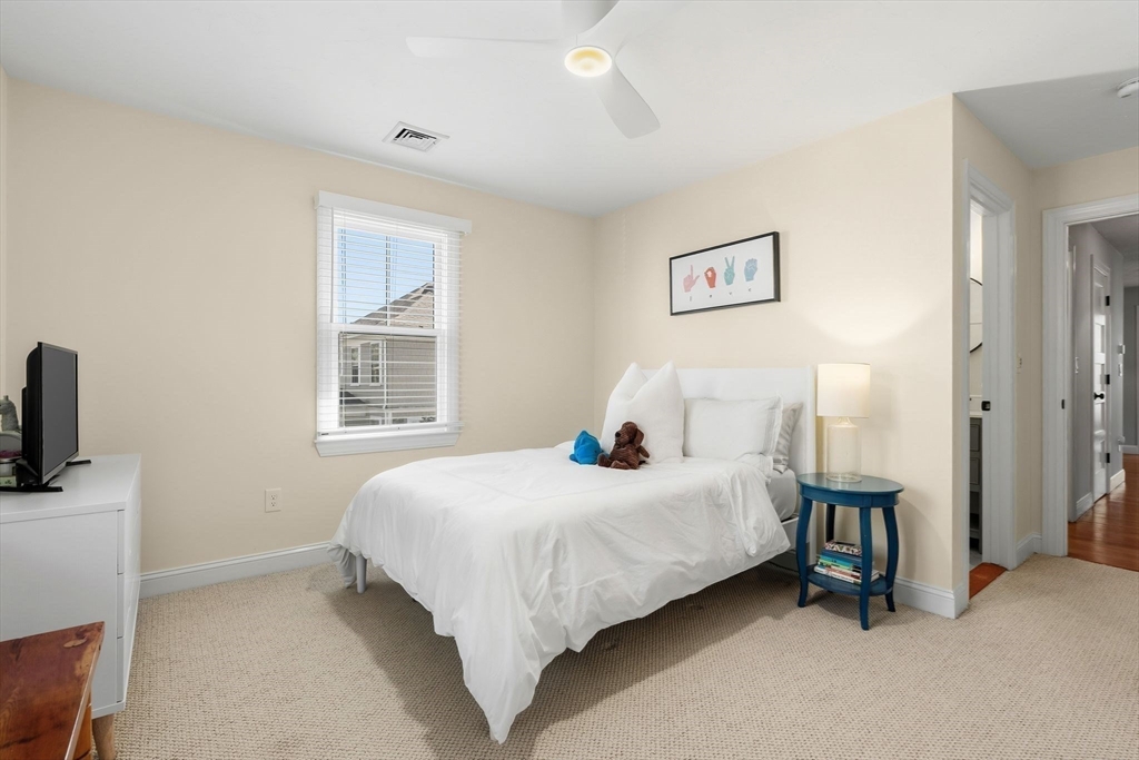 37 Moorland Road Scituate, MA 02066 - Photo 23 of 38 a bedroom with a bed a couch and a window