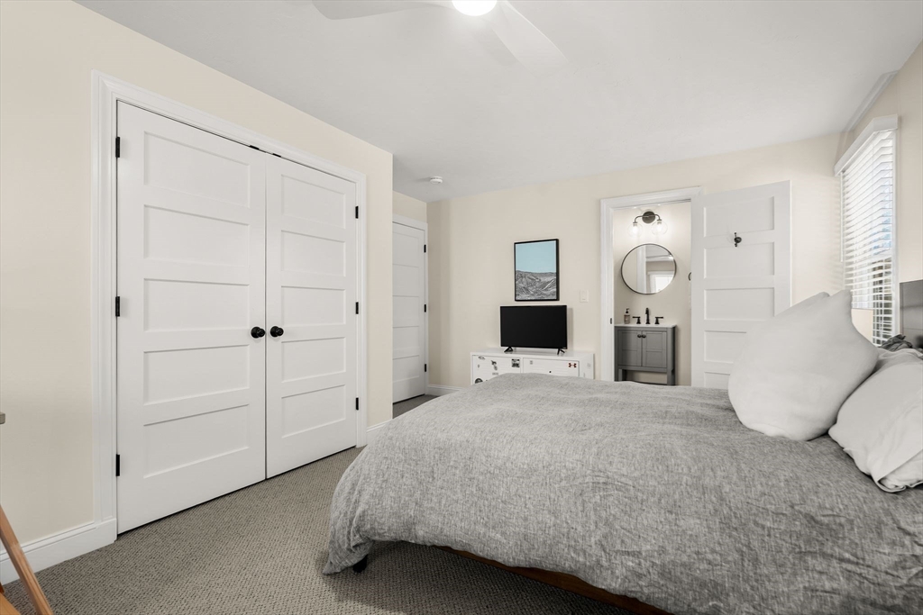 37 Moorland Road Scituate, MA 02066 - Photo 25 of 38 a spacious bedroom with a bed and cabinets