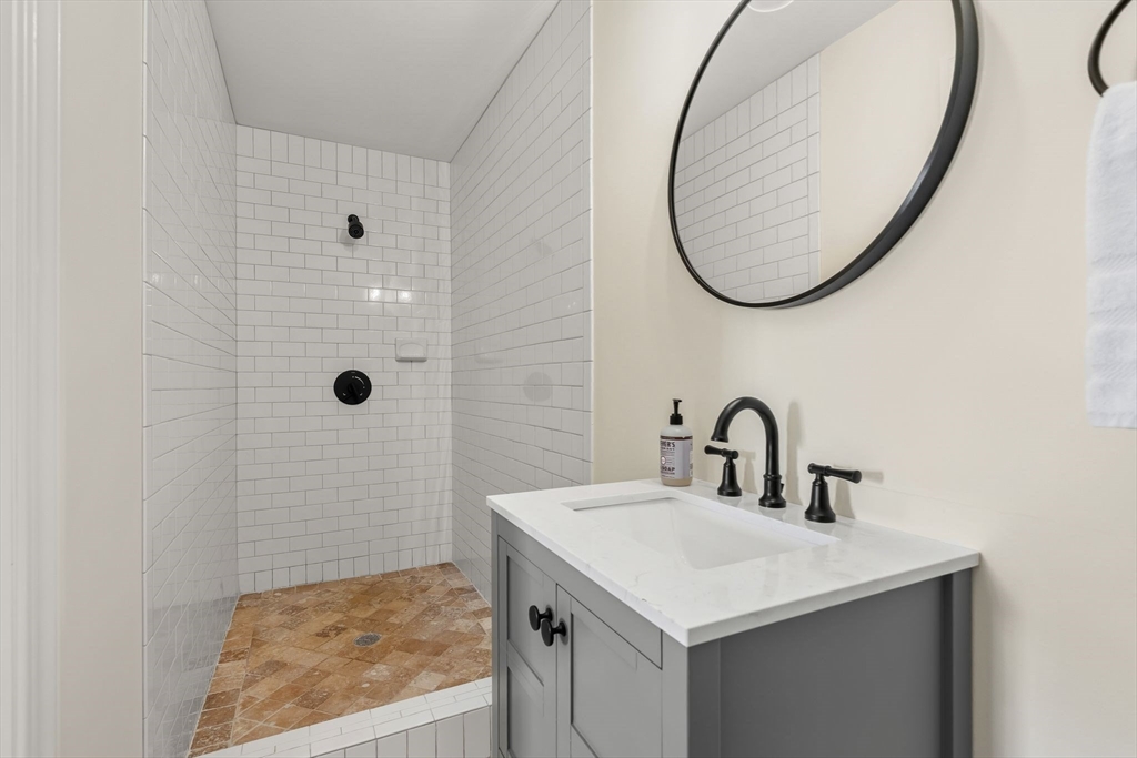 37 Moorland Road Scituate, MA 02066 - Photo 26 of 38 a bathroom with a sink and a mirror