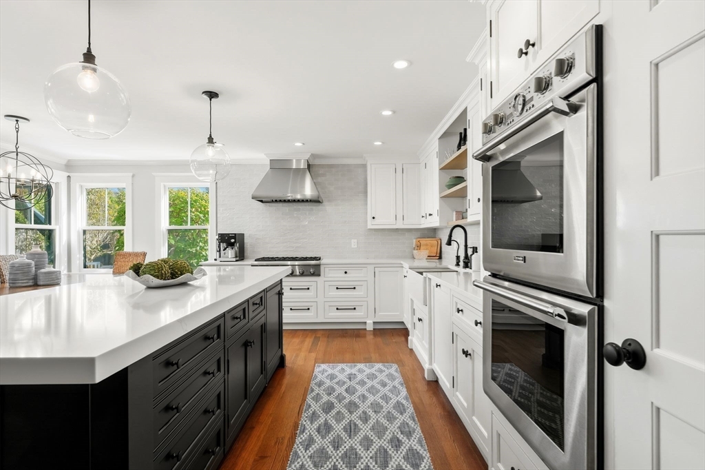 37 Moorland Road Scituate, MA 02066 - Photo 4 of 38 a kitchen with stainless steel appliances granite countertop a sink and a stove