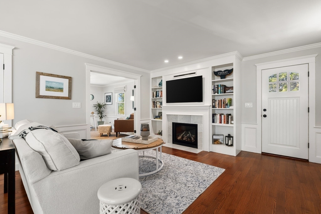 37 Moorland Road Scituate, MA 02066 - Photo 10 of 38 a living room with furniture and a fireplace
