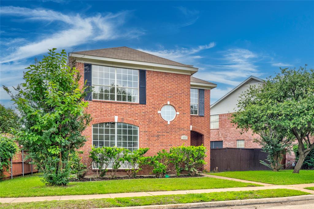 559 Raintree Circle Coppell, TX 75019 - Photo 3 of 40 Brick facade residence featuring a front yard with mature trees