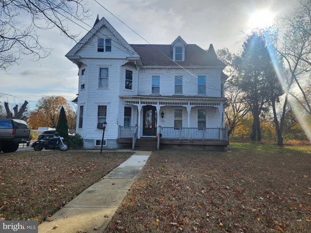 a view of a front of a house with a yard