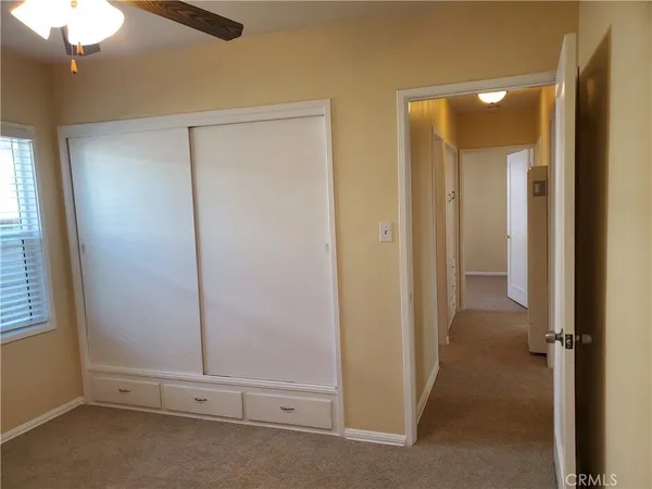 an empty room with cabinet and cabinet