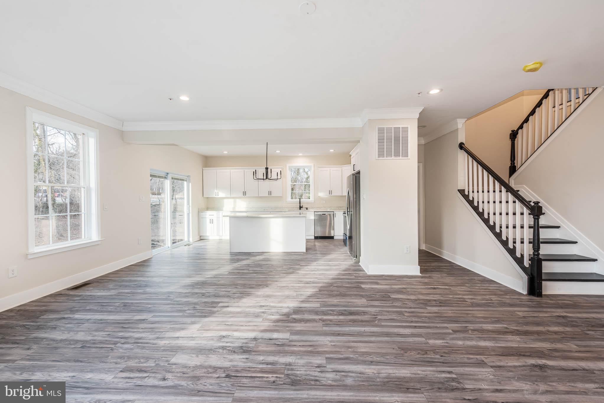 9626 Harford Road Parkville, MD 21234 - Photo 2 of 33 a view of empty room with wooden floor and windows