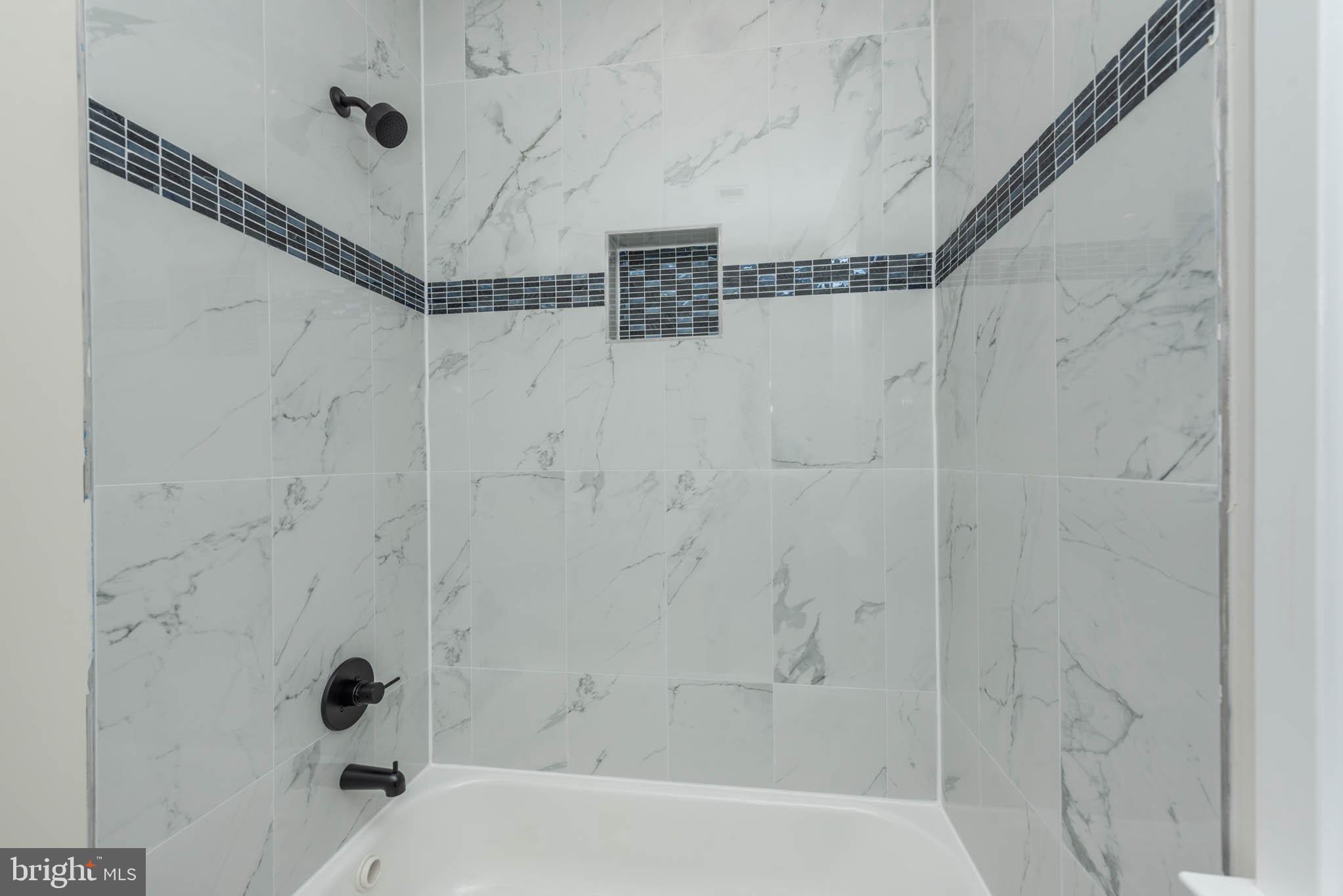 9626 Harford Road Parkville, MD 21234 - Photo 24 of 34 a bathroom with a shower and a shower