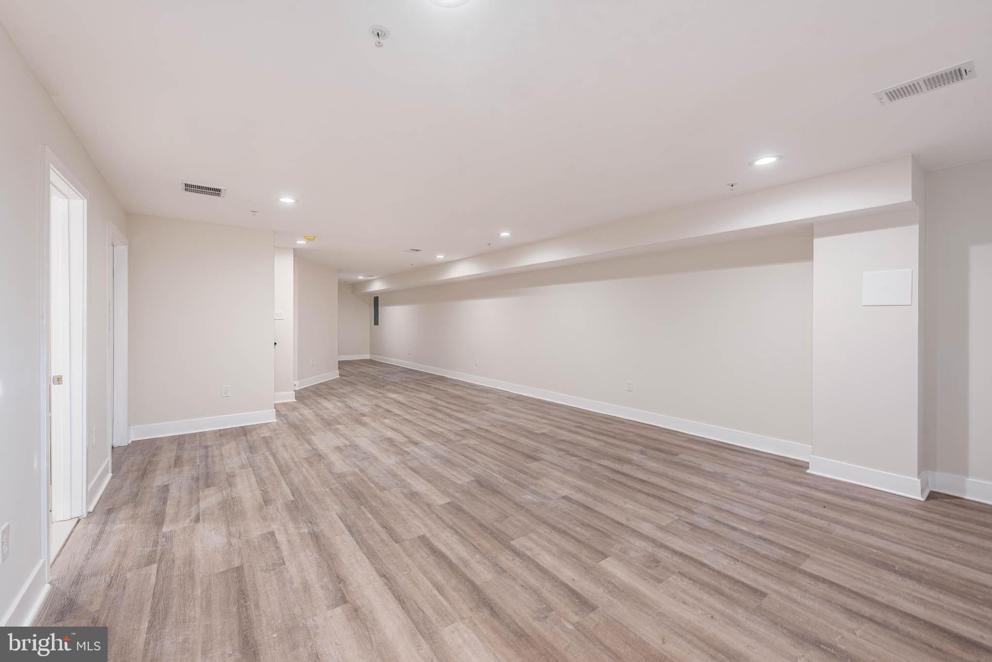 9626 Harford Road Parkville, MD 21234 - Photo 28 of 33 a view of empty room with wooden floor