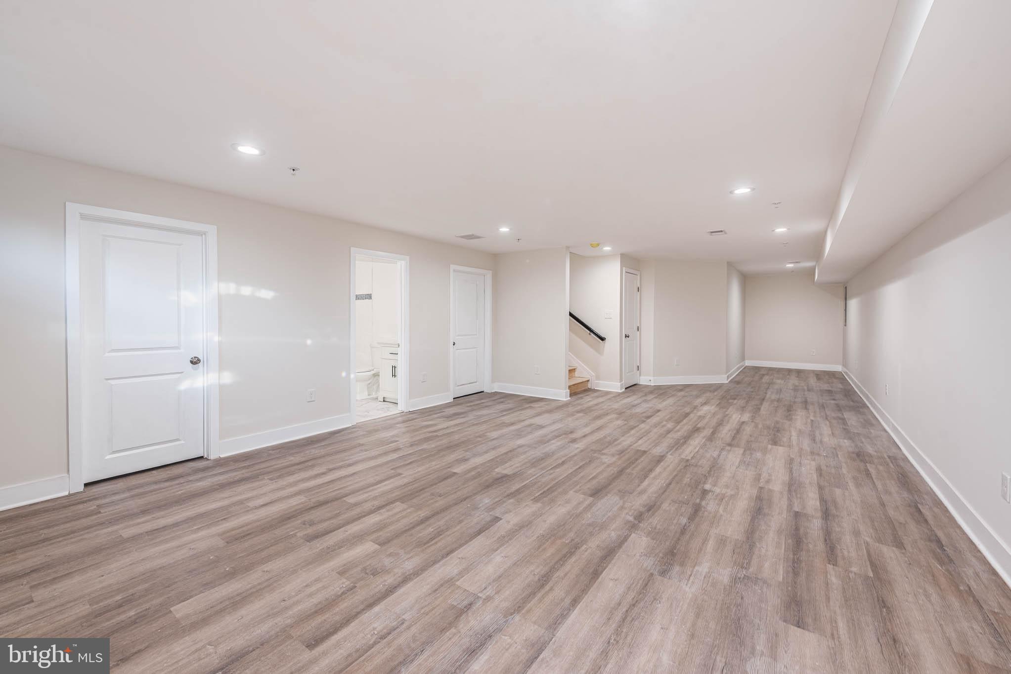9626 Harford Road Parkville, MD 21234 - Photo 28 of 34 a view of empty room with wooden floor