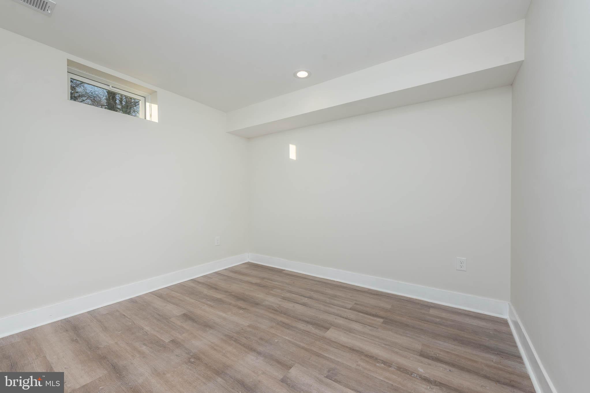 9626 Harford Road Parkville, MD 21234 - Photo 29 of 33 a view of room with wooden floor