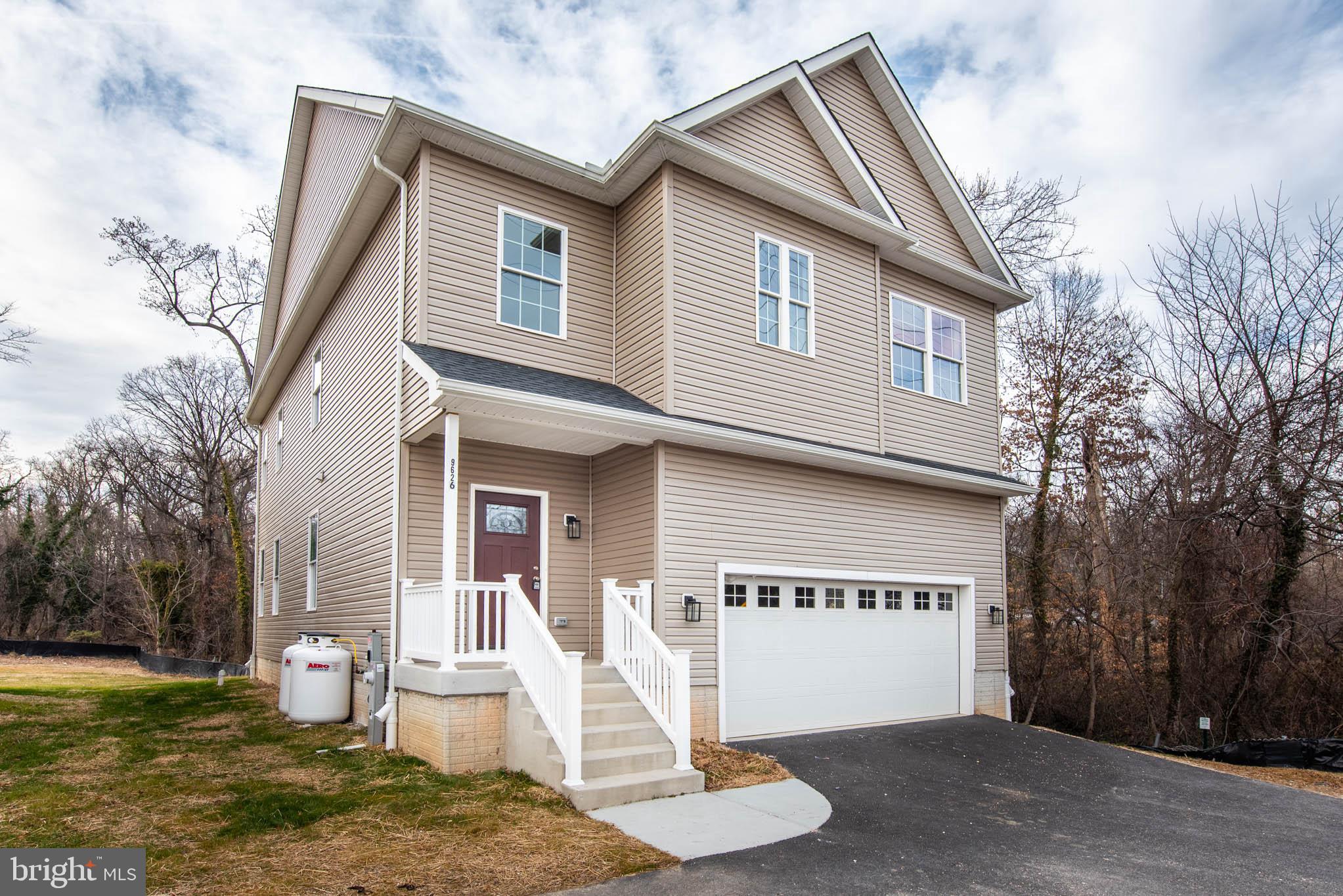 9626 Harford Road Parkville, MD 21234 - Photo 32 of 33 a front view of a house with a yard and garage