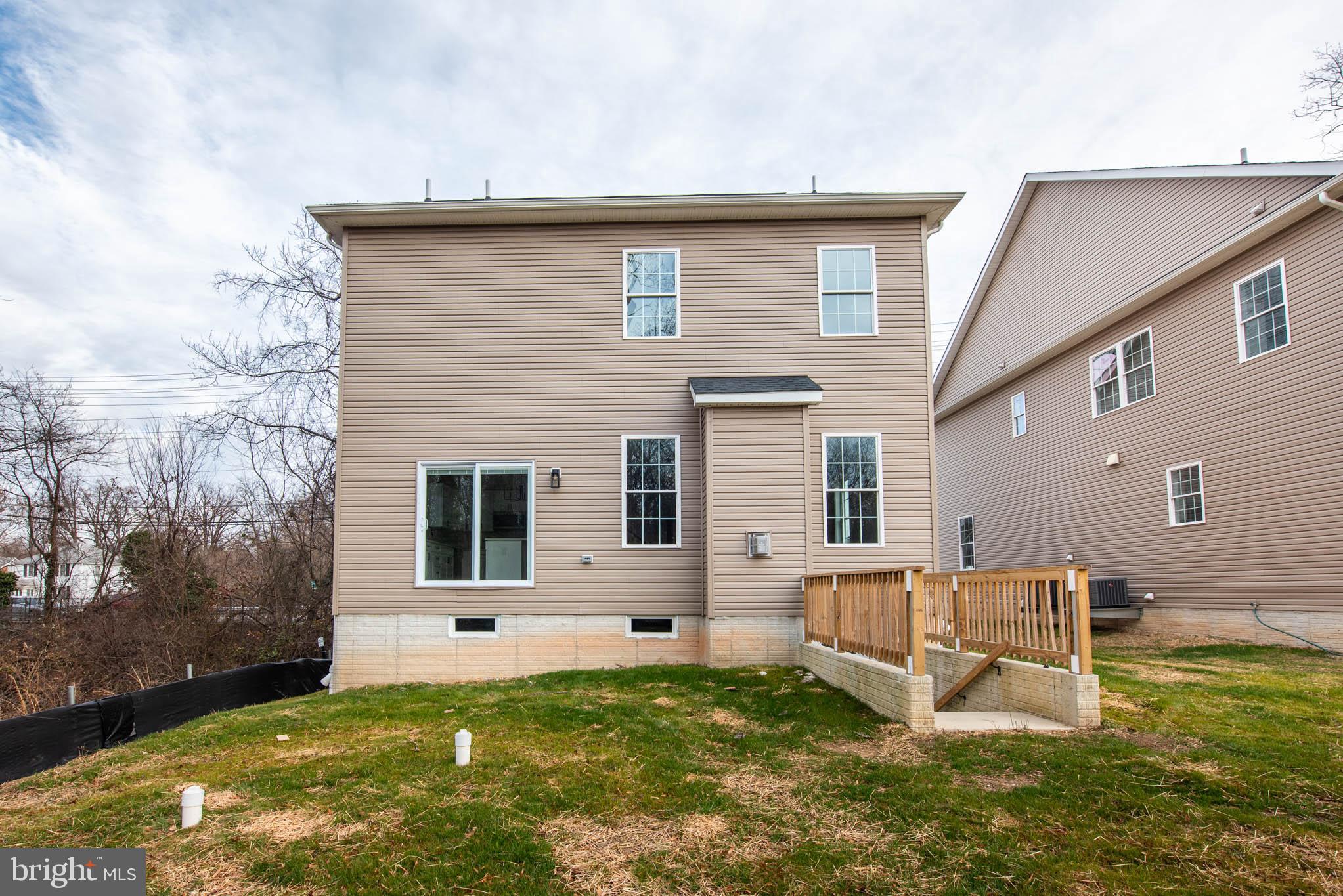 9626 Harford Road Parkville, MD 21234 - Photo 32 of 34 a backyard of a house with swimming pool table and chairs