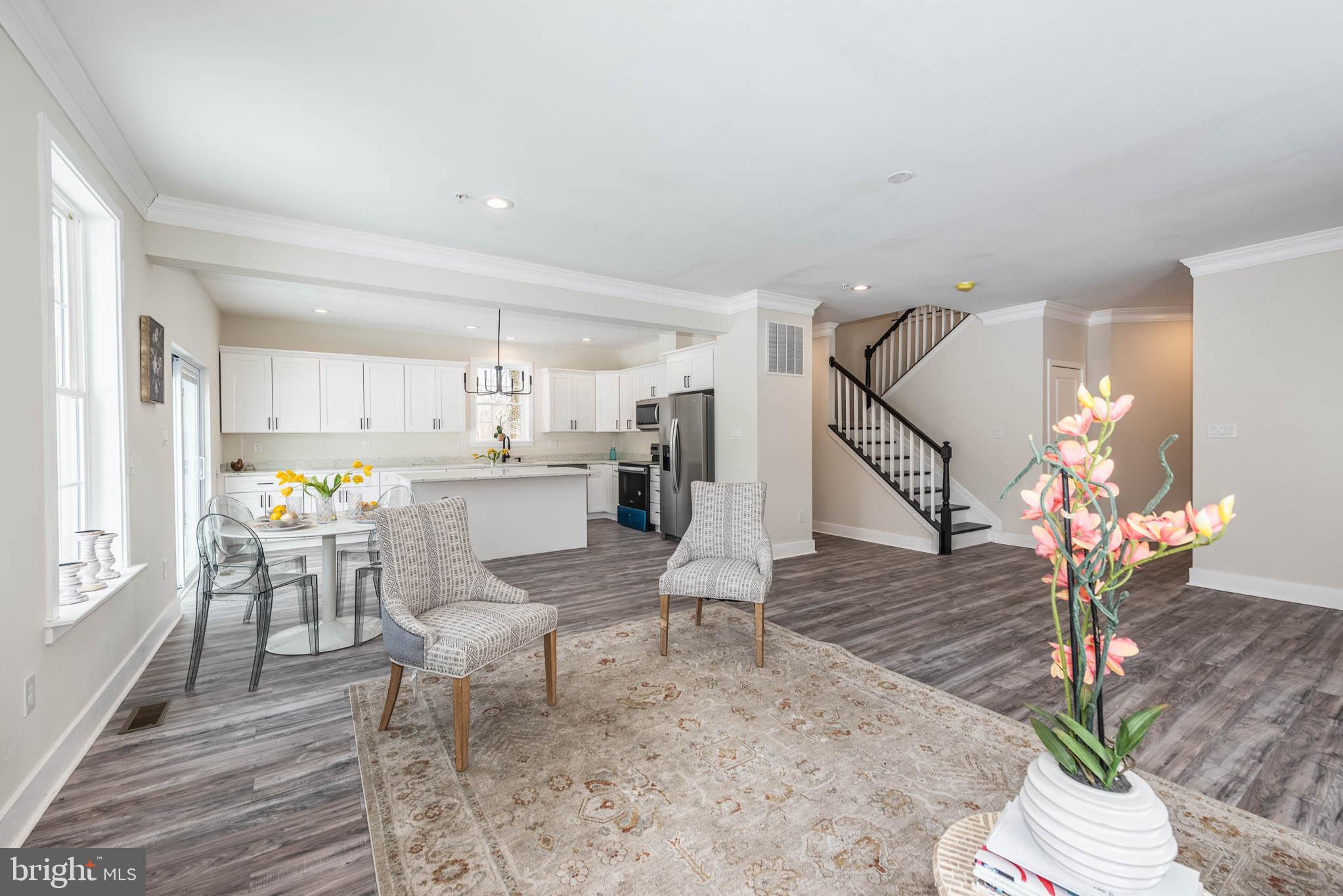 9626 Harford Road Parkville, MD 21234 - Photo 4 of 34 a living room with furniture appliances and wooden floor