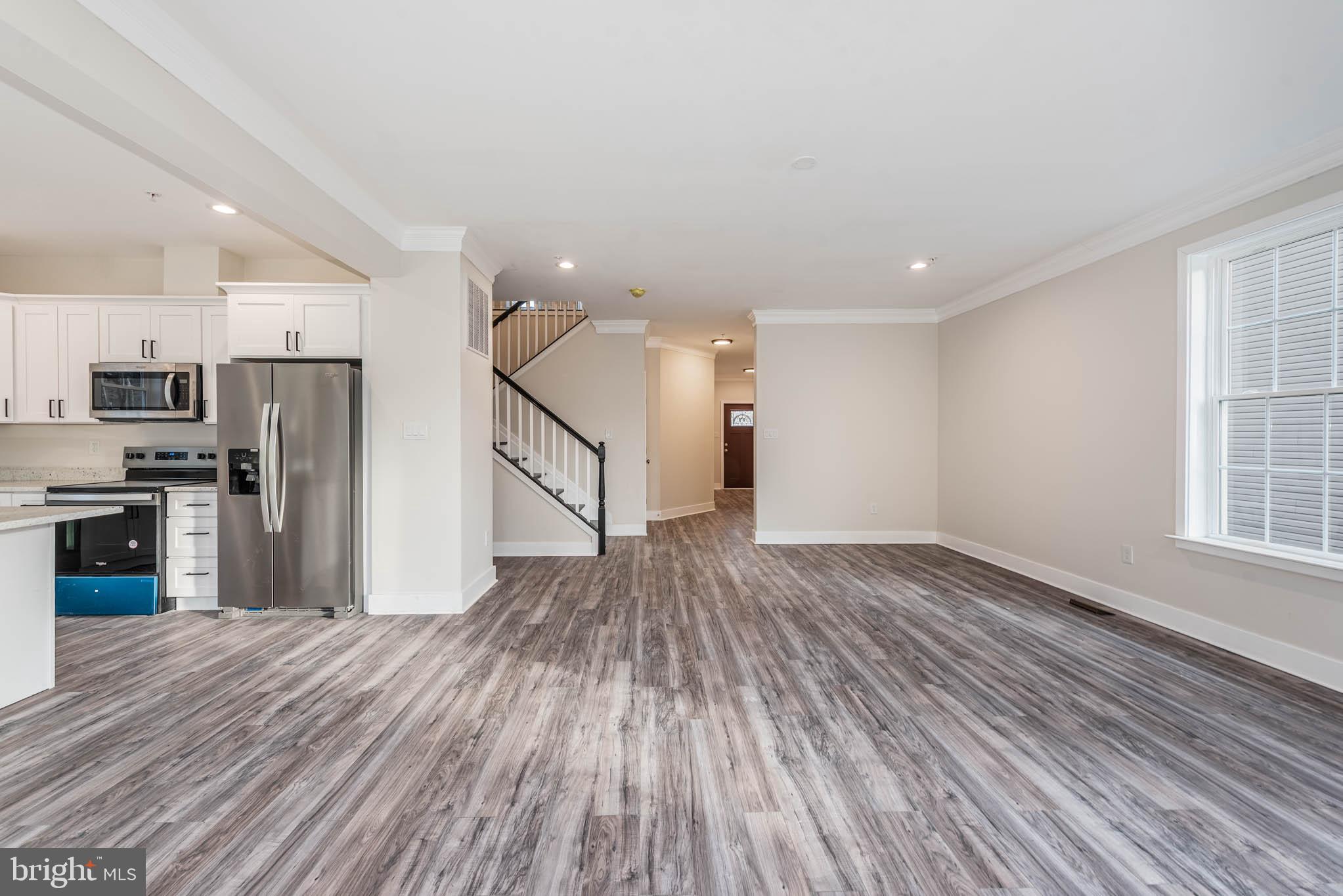9626 Harford Road Parkville, MD 21234 - Photo 4 of 33 a view of a kitchen with a sink and a refrigerator