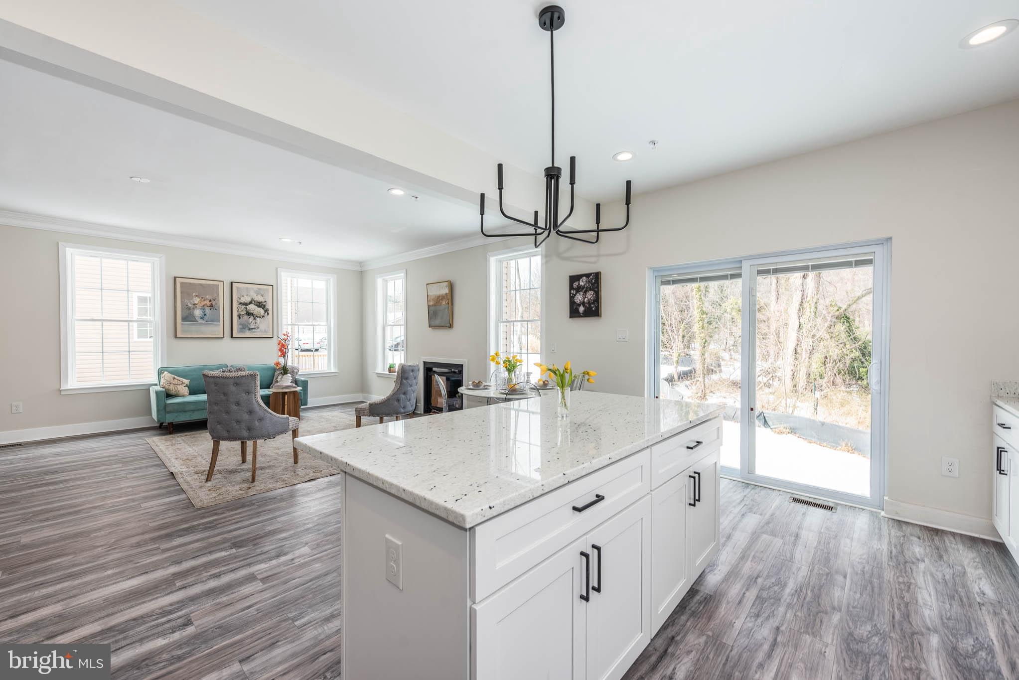 9626 Harford Road Parkville, MD 21234 - Photo 6 of 34 a large kitchen with kitchen island a wooden floor