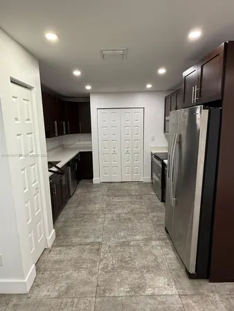 a view of a hallway with stairs
