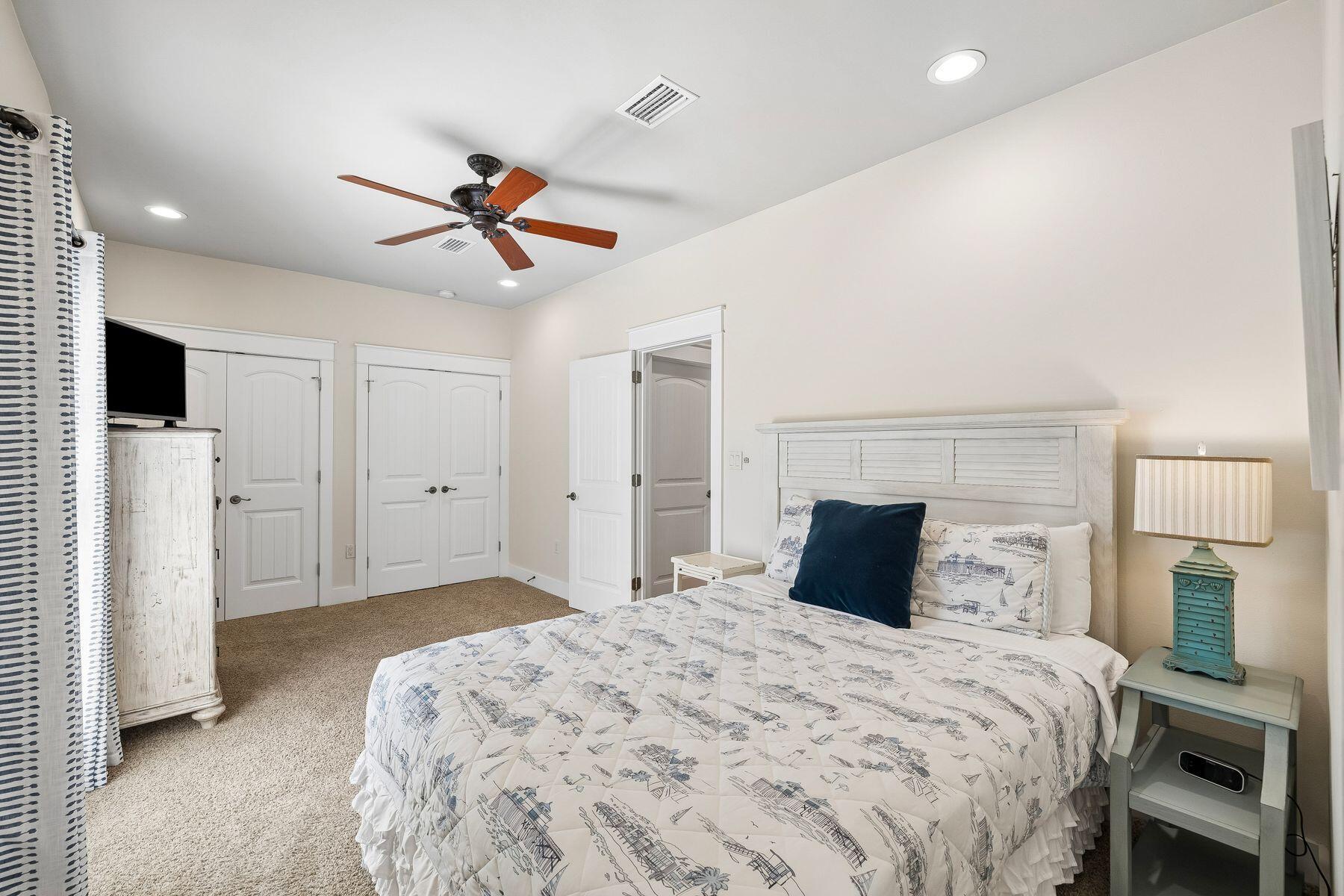 39 Willow Mist Road Inlet Beach, FL 32461 - Photo 17 of 41 a bedroom with a bed and a ceiling fan