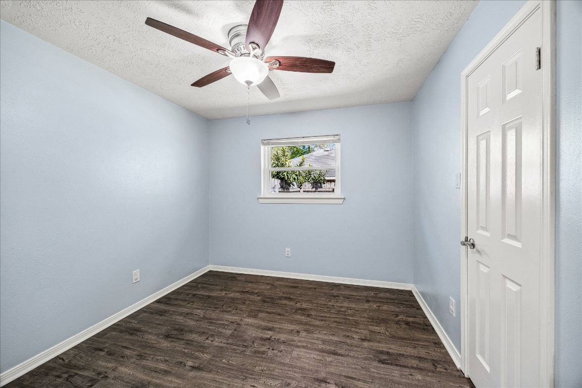 25732 Chestnut Lane Splendora, TX 77372 - Photo 12 of 27 Bedroom 1 with vinyl plank flooring, natural light, and a ceiling fan