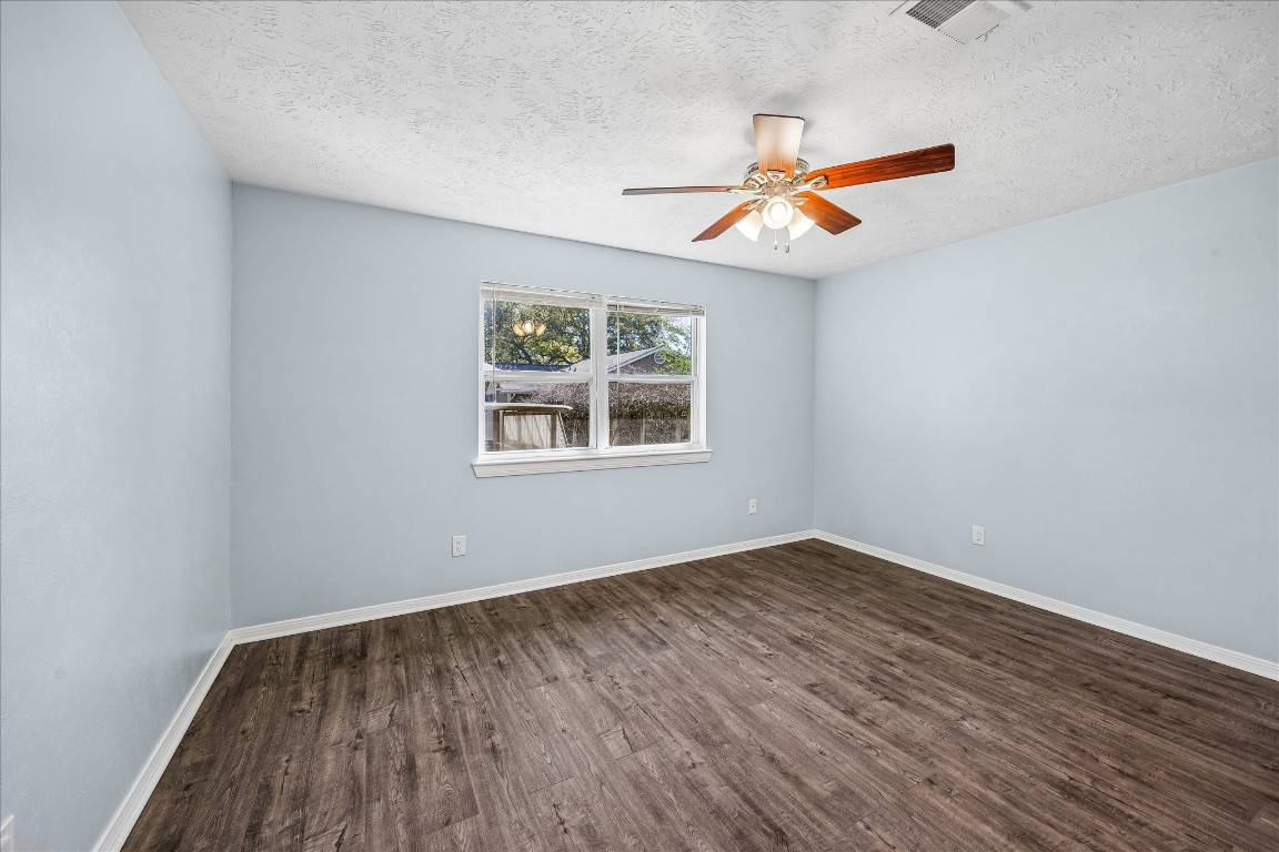 25732 Chestnut Lane Splendora, TX 77372 - Photo 16 of 27 Primary bedroom with natural light and views of the backyard