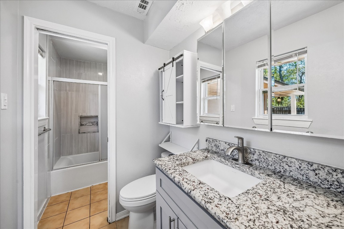 25732 Chestnut Lane Splendora, TX 77372 - Photo 19 of 27 Primary bathroom with updated vanity, granite countertop, and access to the shower area.