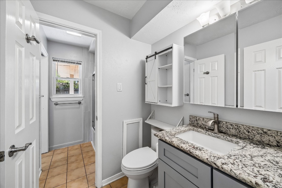 25732 Chestnut Lane Splendora, TX 77372 - Photo 20 of 27 Secondary bathroom with updated vanity, granite countertops, and access to the shower area.