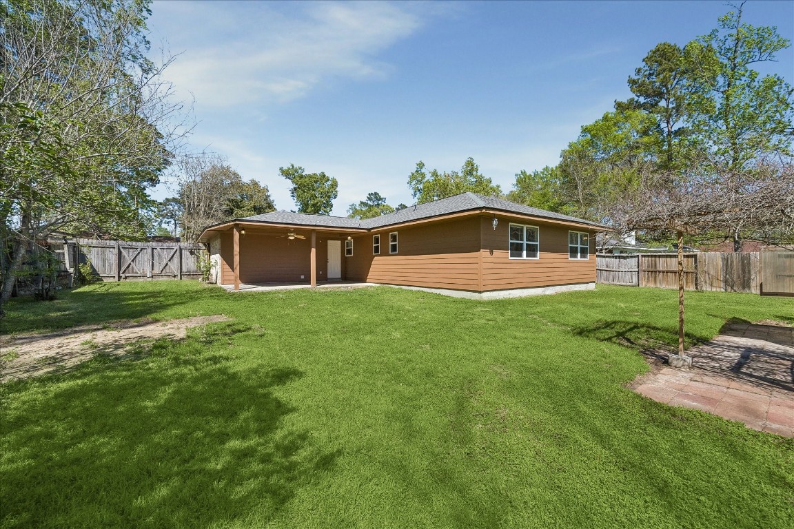 25732 Chestnut Lane Splendora, TX 77372 - Photo 23 of 27 Spacious backyard with plenty of room for outdoor activities.
