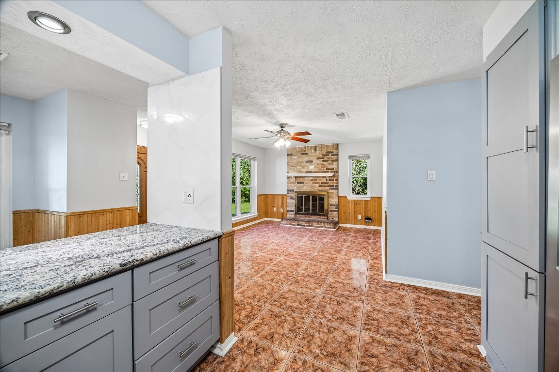 25732 Chestnut Lane Splendora, TX 77372 - Photo 9 of 27 Kitchen open to the living area with recessed lighting and a connected, functional layout.