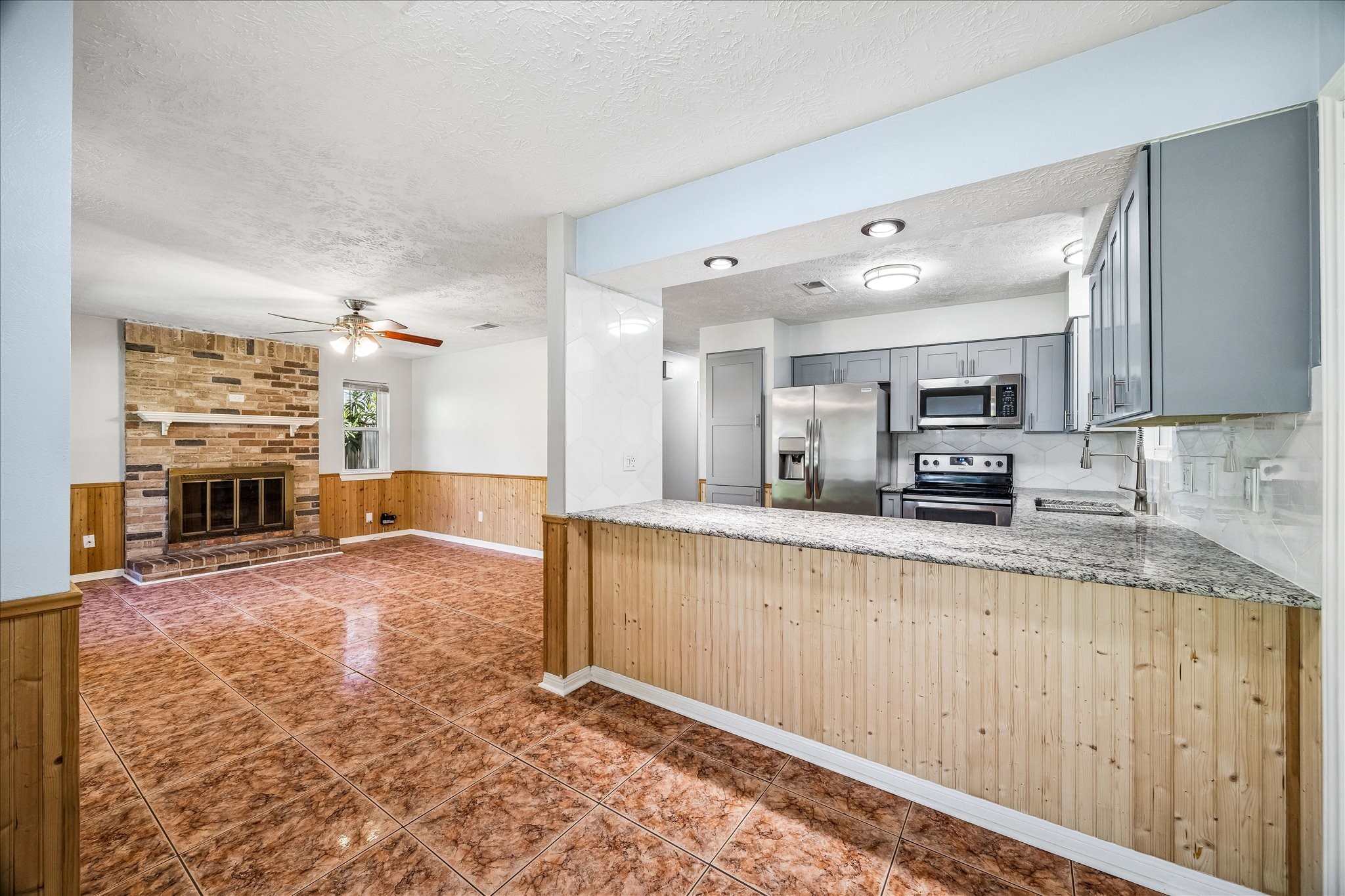 25732 Chestnut Lane Splendora, TX 77372 - Photo 10 of 27 Spacious kitchen with bar seating and plenty of counter space.