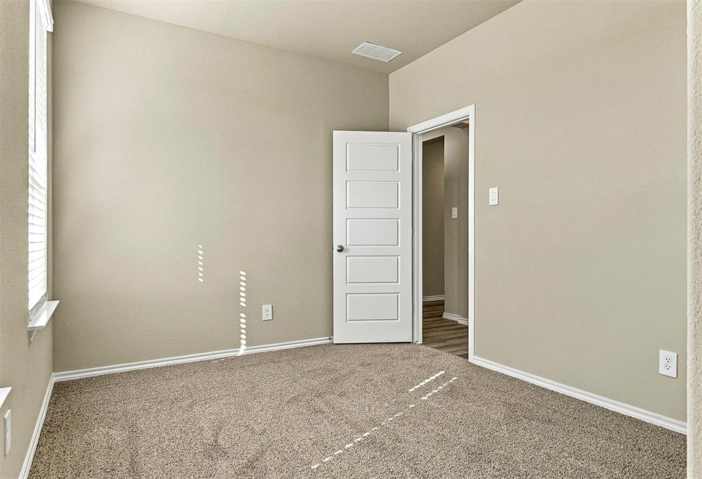 15932 Stableford Road Justin, TX 76247 - Photo 19 of 35 Neutral wall finish, carpeted flooring, white trim details, window with blinds, and a five-panel interior door
