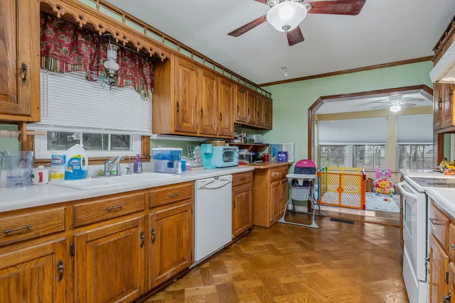a kitchen with cabinets a sink and appliances