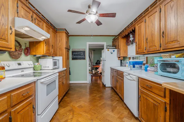 a kitchen with a stove top oven sink and cabinets