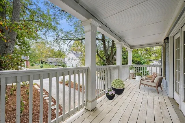 a view of balcony with couch and wooden floor