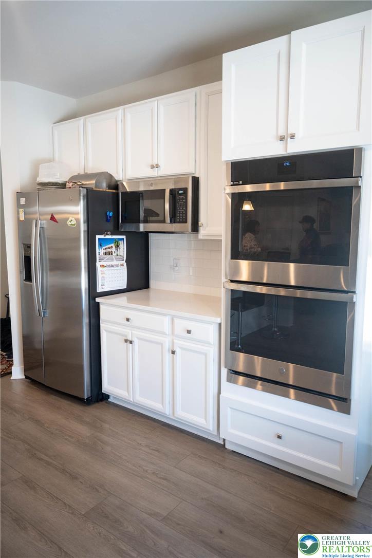 3951 Trythall Street Bethlehem, PA 18020 - Photo 12 of 25 a kitchen with granite countertop white cabinets and stainless steel appliances