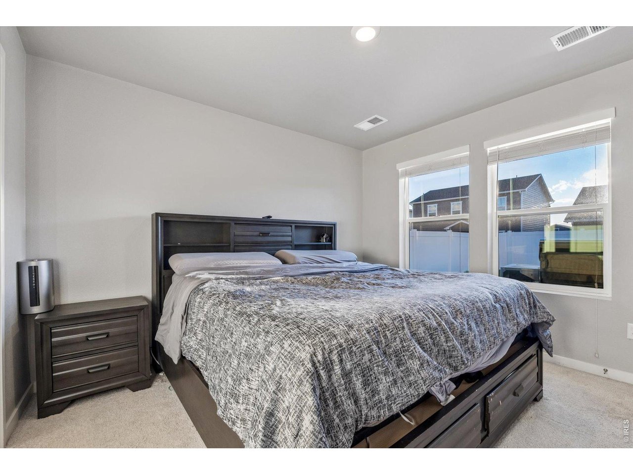 379 Beckwourth Avenue Fort Lupton, CO 80621 - Photo 11 of 26 a bedroom with a bed and wooden floor