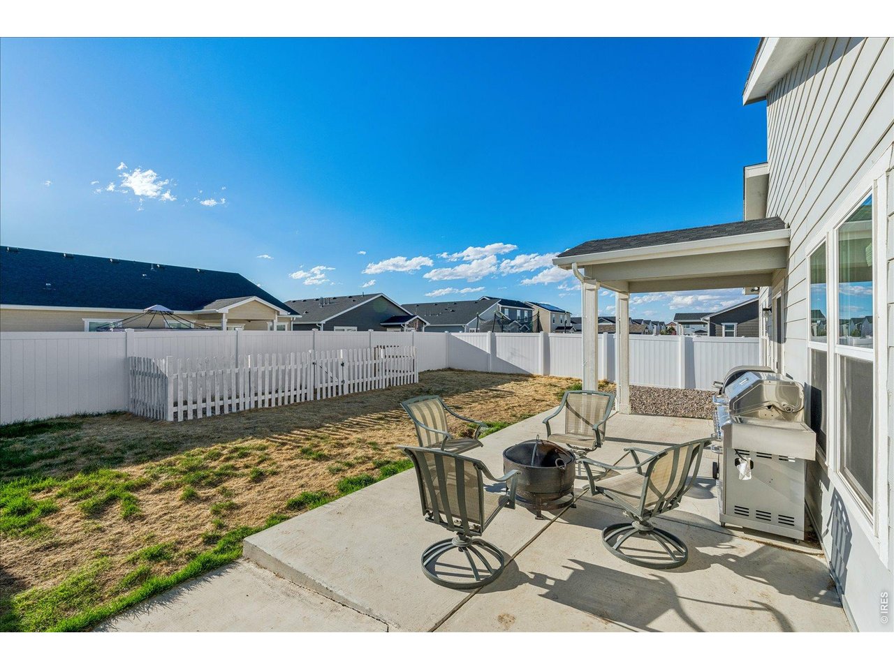 379 Beckwourth Avenue Fort Lupton, CO 80621 - Photo 25 of 26 a view of a patio with table and chairs