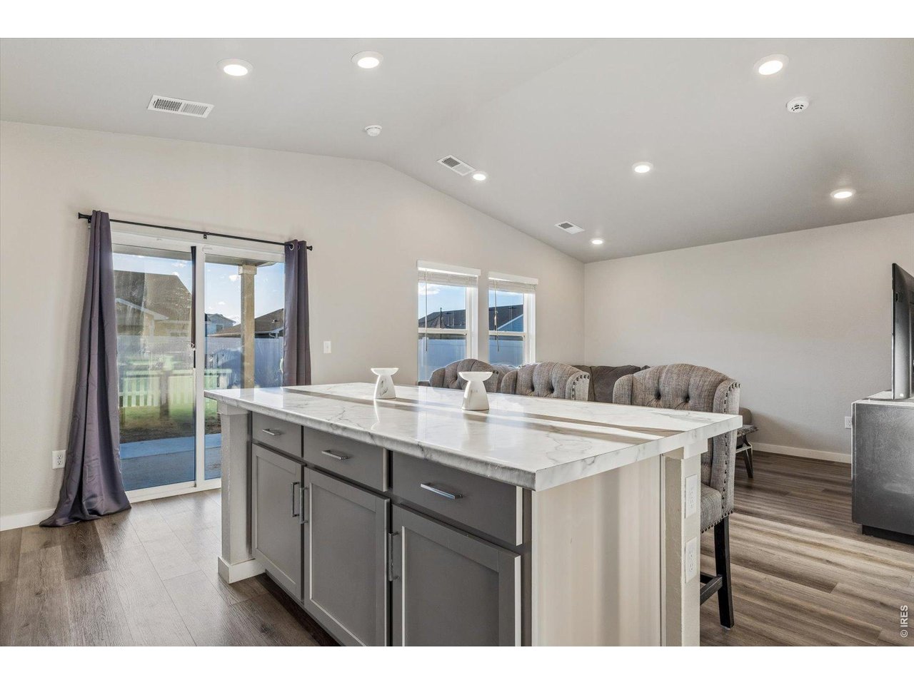 379 Beckwourth Avenue Fort Lupton, CO 80621 - Photo 7 of 26 a kitchen with a sink a refrigerator and wooden floor