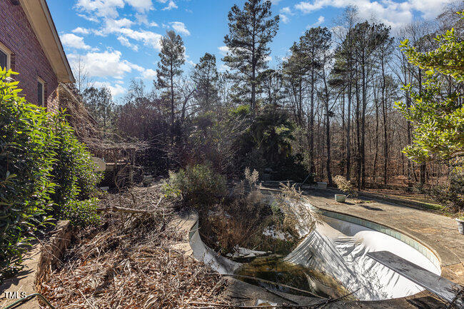 6613 Swallowtail Lane Raleigh, NC 27613 - Photo 3 of 7 a view of a backyard of the house
