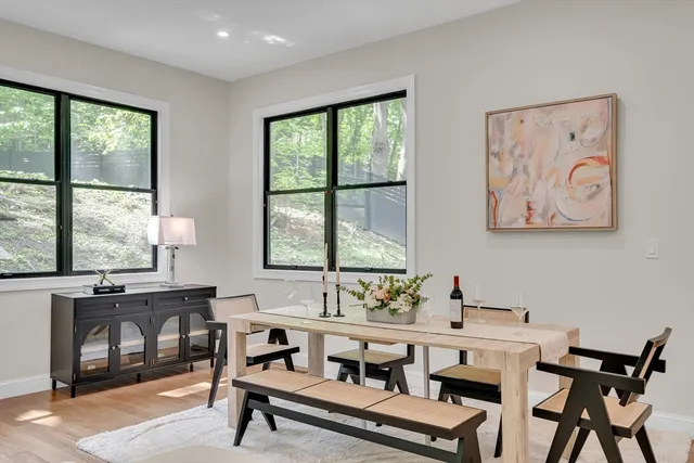 a view of a dining room with furniture window and outside view