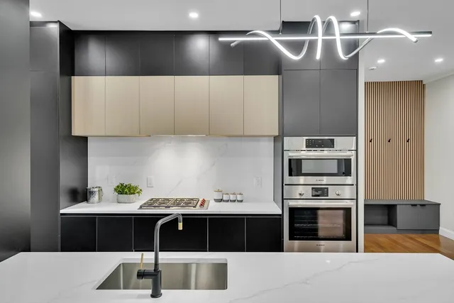 a kitchen with a cabinets and appliances