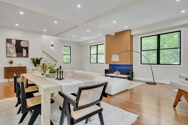 a kitchen with a table chairs and a refrigerator