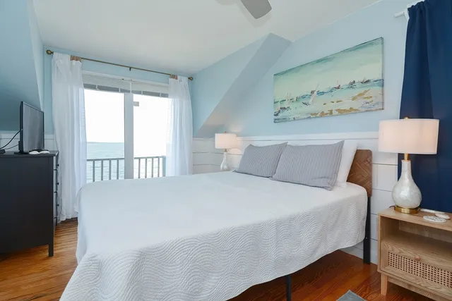 a bedroom with furniture and a window