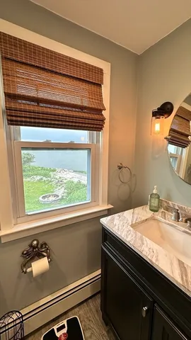 a bathroom with a sink and a window