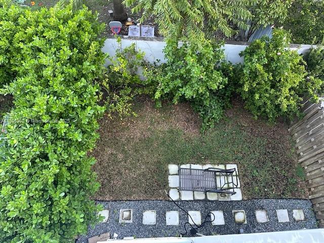 3089 Southwest 21st Street, Unit 3089 Miami, FL 33145 - Photo 14 of 15 a view of a bench in the backyard