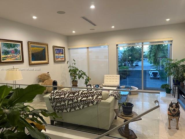 3089 Southwest 21st Street, Unit 3089 Miami, FL 33145 - Photo 3 of 15 a bedroom with furniture and a large window