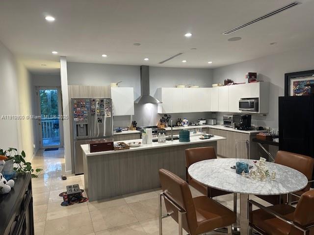 3089 Southwest 21st Street, Unit 3089 Miami, FL 33145 - Photo 4 of 15 a kitchen with counter space cabinets appliances and a center